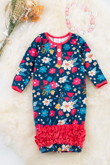  Floral printed on navy blue infant gown with ruffle detail. PJG65133013