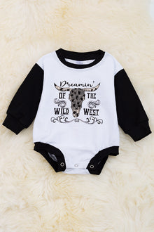  Dreamin' of the Wild West" bull skull printed on white baby onesie. RPB65153055 amy