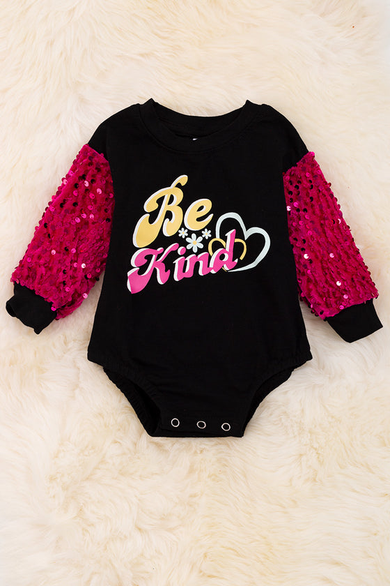 "Be Kind" Black baby onesie with Fuchsia sequins sleeves. RPG65133105 Jeann