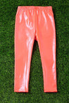 Neon orange satin silk stretchy leggings. PNG25153076 amy