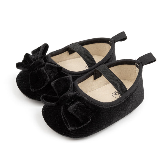 Front Bow velvety baby shoes, available in black and pink.