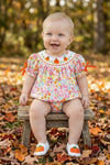 Floral smock baby romper with snaps. RPG62710 SOL