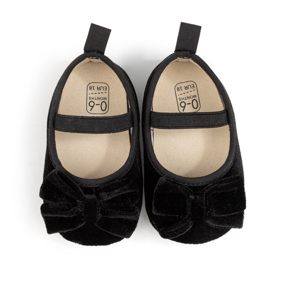 Front Bow velvety baby shoes, available in black and pink.