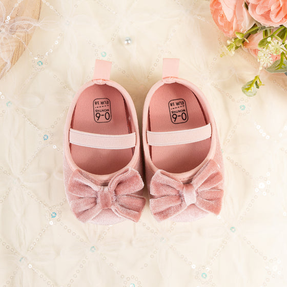 Front Bow velvety baby shoes, available in black and pink.