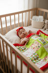 32 inch X 32 inch Green & red Christmas printed baby blanket.