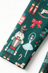 Nutcracker printed girls dress with red ruffle hem and open back with bows. DRG65443 AMY