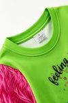 "Feeling Extra Gri today" Green top with fuchsia fur sleeves. TPG60772 BRE