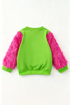 "Feeling Extra Gri today" Green top with fuchsia fur sleeves. TPG60772 BRE