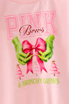 Lt. Pink Christmas character holding a bow and ruffle hem on sleeves. TPG60756 BRE