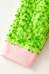 2 Bows & Christmas character printed on Lt. Pink top with green sequins sleeves. TPG60768 BRE