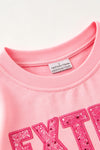 Extra Grin--chy character printed pink top with green sequins sleeves. TPG60770 AMY