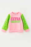 Extra Grin--chy character printed pink top with green sequins sleeves. TPG60770 AMY