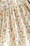 Ivory floral printed girls dress with lace hem and bubble sleeve. DRG64564 MON