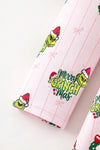 Christmas character on lt. pink dress with red ruffle hem. DRG65528 SOL