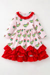Christmas character on lt. pink dress with red ruffle hem. DRG65528 SOL