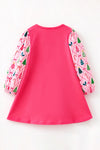 Hot pink Christmas dress with front pockets & multi-printed sleeves. DRG65531 Bre