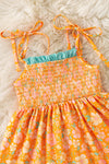 Orange ditsy floral w/mauve green ruffle trim smock dress. DRG60499 SOL
