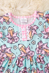 Coquette pencil printed on aqua color dress with gingham ruffle trim DRG51157