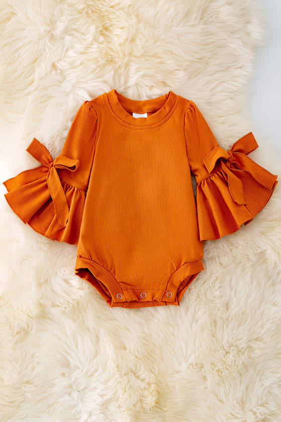 RPG40286 LOI: burnt orange bubble sleeve baby onesie w/snaps.