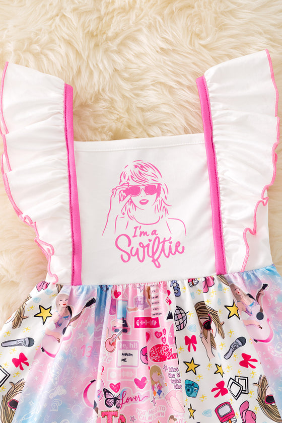 I'm a Swift*e multi-printed girls dress. DRG51318