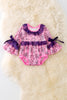 Spider web printed on pink baby onesie with purple lace and bell sleeves. RPG50951 SOL