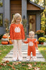 Pumpkin printed applique  on orange sweatshirt with ruffle hem & floral pants. OFG61732 AMY