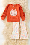 Pumpkin printed applique  on orange sweatshirt with ruffle hem & floral pants. OFG61732 AMY