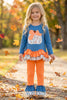 Blue top w/white polka dot & ruffle hem and orange pants. OFG61765 MON