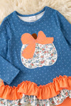 Blue top w/white polka dot & ruffle hem and orange pants. OFG61765 JEAN
