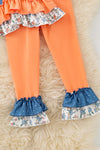 Blue top w/white polka dot & ruffle hem and orange pants. OFG61765 JEAN