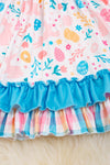Easter printed dress w/turquoise contrast ruffle trim. DRG20114006 Jeann
