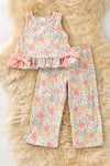 A playful floral tunic with a ruffled hem, adorned with side bows and bottoms. OFG62051 SOL
