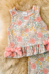A playful floral tunic with a ruffled hem, adorned with side bows and bottoms. OFG62051 SOL