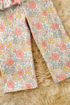 A playful floral tunic with a ruffled hem, adorned with side bows and bottoms. OFG62051 SOL
