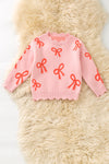 Coral bow on pink pullover knit sweater w/ scalloped hem. TPG60463 AMY