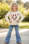 Horse shoe on cream knot pullover sweater w/moon stitch. TPG60491 SOL