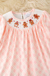 Smock pink plaid tunic with embroidered ginger cookie and red pants. OFG61530 MON