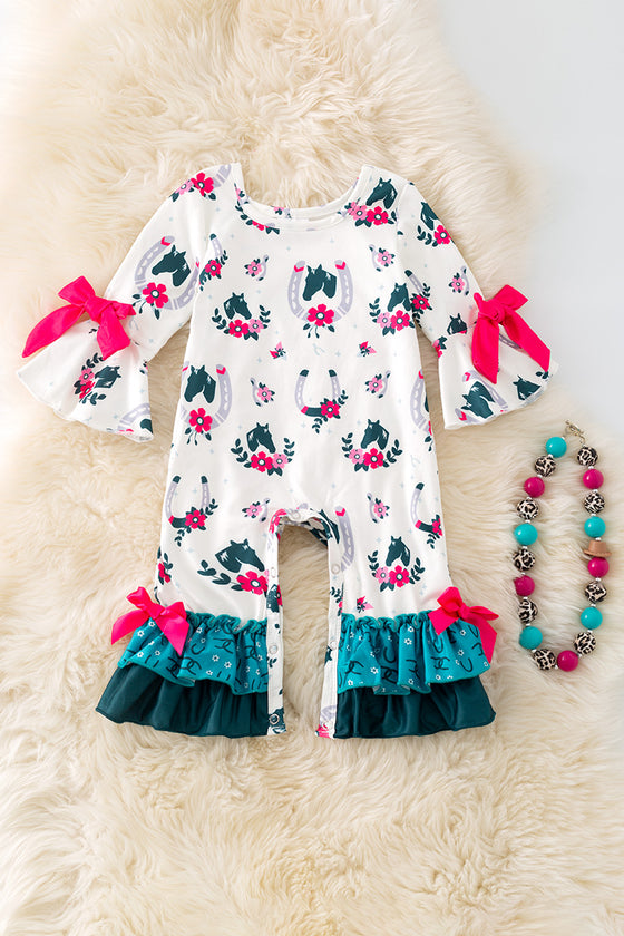 Horseshoe printed on white baby romper with ruffle hem. RPG52076 AMY