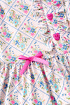 Floral printed w/fuchsia front button and ruffle shorts. OFG62612 AMY
