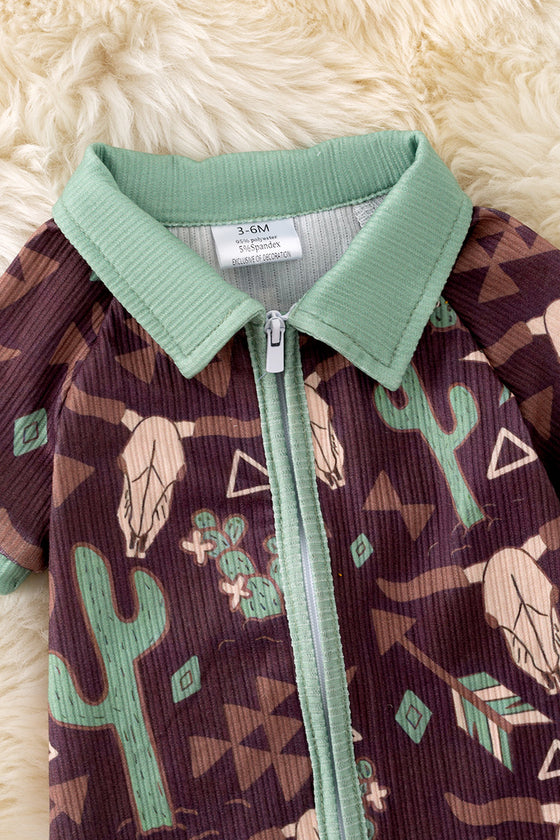 Bull skull & cactus printed on brown baby romper with green trim. RPB50494 JEAN