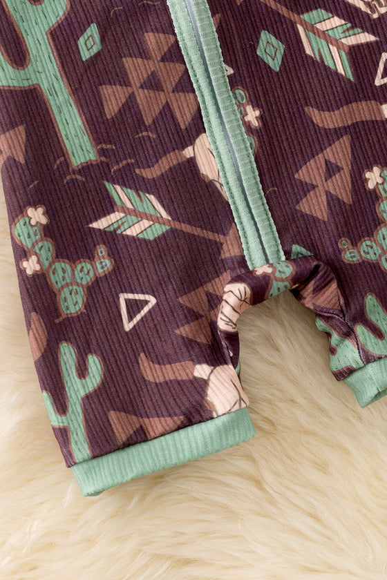 Bull skull & cactus printed on brown baby romper with green trim. RPB50494 JEAN