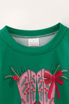 Cowboy western boots on green top with bow detail on sleeves. TPG60475 Mon