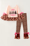 "Howdy Christmas" Cream top with cow printed bell sleeved and animal printed pants. OFG61882 MON