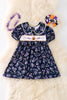 Navy blue floral smocked floral dress with bubble sleeves. DRG52121 SOL