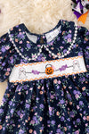 Navy blue floral smocked floral dress with bubble sleeves. DRG52121 SOL