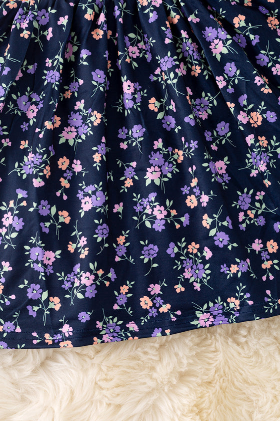 Navy blue floral smocked floral dress with bubble sleeves. DRG52121 SOL