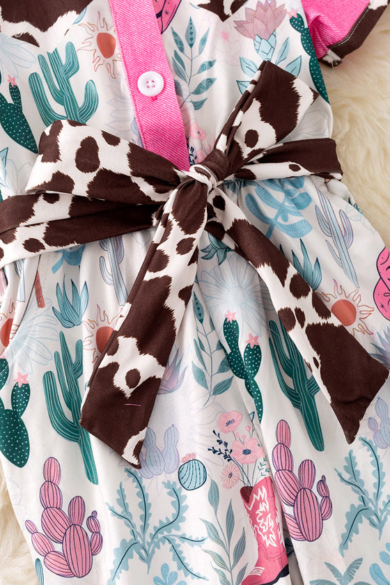 Cow printed and fuchsia trim girls jumpsuit. PNG50410 SOL
