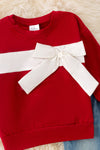 Red long sleeve sweatshirt with denim pants.  OFG50980 SOL