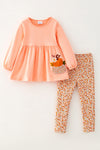 Lt. Coral tunic with pumpkin applique and floral leggings. OFG61931 SOL