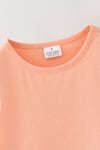 Lt. Coral tunic with pumpkin applique and floral leggings. OFG61931 SOL